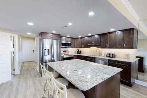 a kitchen with a granite counter top and wooden cabinets at Plaza 211 in Ocean City