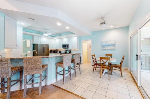 a kitchen and dining room with a table and chairs at Turtle Shores in Ocean Pines