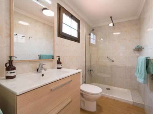 a bathroom with a sink and a toilet and a tub at Sunny Haven I in Maspalomas