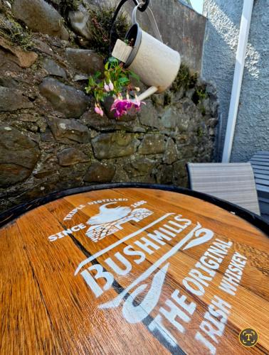 a wooden table with a sign on top of it at Butterlump Cottage in Glastry