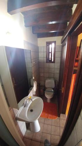 a small bathroom with a sink and a toilet at Stou Kir Yianni in Omodos