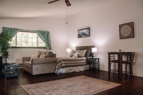 a living room with a couch and a window at Coastal Studio in Brookings