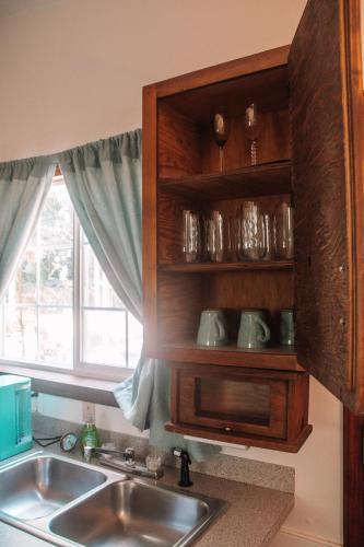 a kitchen with a sink and a window at Coastal Studio in Brookings