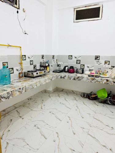 a room with a marble counter top in a room at Sadhana kunj in Varanasi