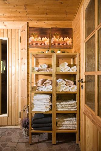 a room with a rack of plates and dishes at Chata Vanilka in Bělá pod Pradědem