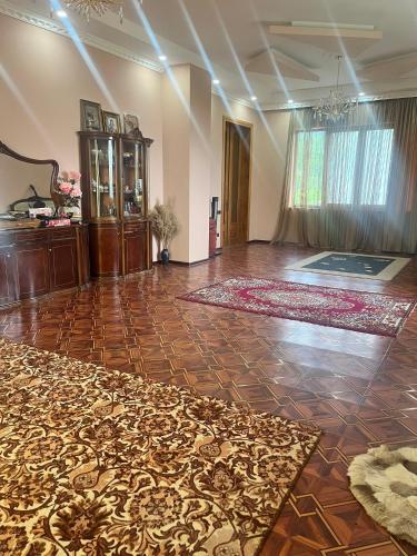a large room with a dance floor with a rug at Kakuti village in Natskhavatevi