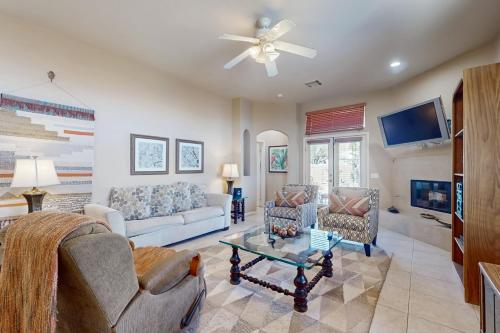 a living room with two couches and a tv at Lovely La Quinta - 66318 in La Quinta