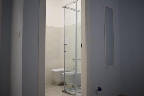 a glass shower in a bathroom with a toilet at B&B Nonna Matilde in Sapri