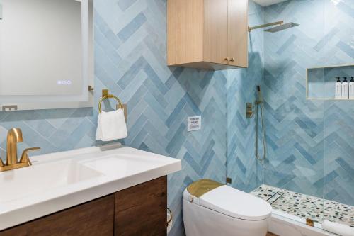 a bathroom with a sink and a toilet at The Boardwalk Hotel in San Diego
