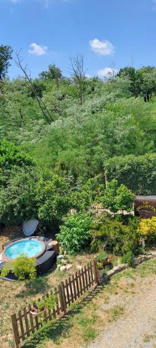 a backyard with a swimming pool and a fence at Casa Bellotta in Suno