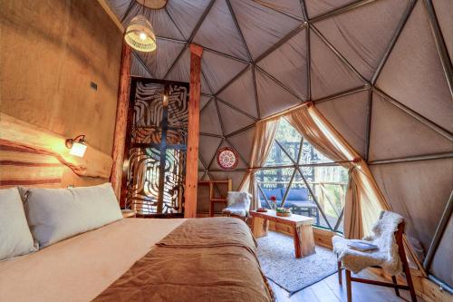 a room with a bed and a window in a room at Cascada de las Animas in San Alfonso