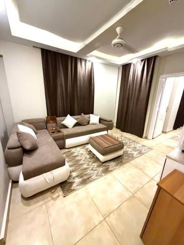 a living room with a couch and a table at La Boutique Residence in Hurghada