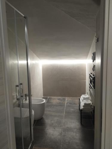 a bathroom with a shower and a bath tub at Country House Villa Marezi in Cupra Marittima