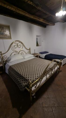 a bedroom with two beds in a room at Antica osteria in Primaluna