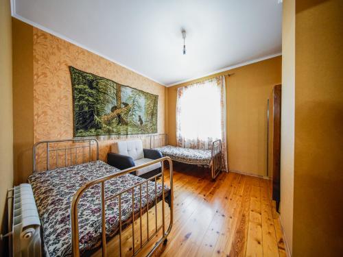 a bedroom with two bunk beds and a couch at guest hause "villa" in Dushetʼi