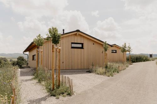 a building in the middle of a dirt road at Hüttenchalets Rhön in Geisa