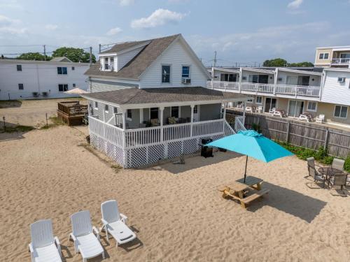 an overhead view of a beach with chairs and an umbrella at Echo Motel in Old Orchard Beach