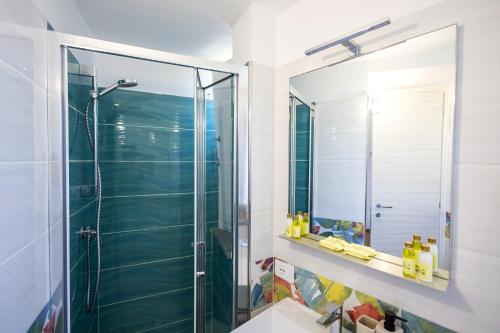 a bathroom with a shower and a mirror at Annalì in Trentinara
