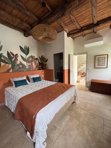 a bedroom with a large bed in a room at Valadouro Dona Adelaïde With a Pool in Espinhosa