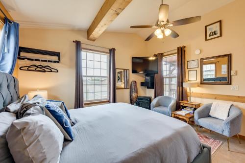 a bedroom with a bed and a ceiling fan at Cute Studio Cabin Steps to Long Beach Boardwalk in Long Beach