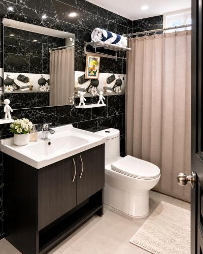 a bathroom with a white sink and a toilet at Villa Spa Mega Relax in San Francisco de Macorís