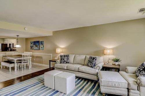 a living room with a couch and a table at Courtside 56 in Hilton Head Island