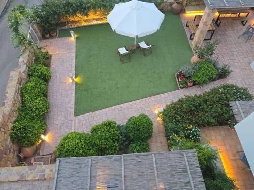 an overhead view of a garden with an umbrella at Chios Shallow Sea in Karfas