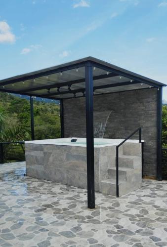 a pavilion with aitatingificialificialificialificialificialificialificialificialificialificial at Quinta Emmanuel in Guaduas