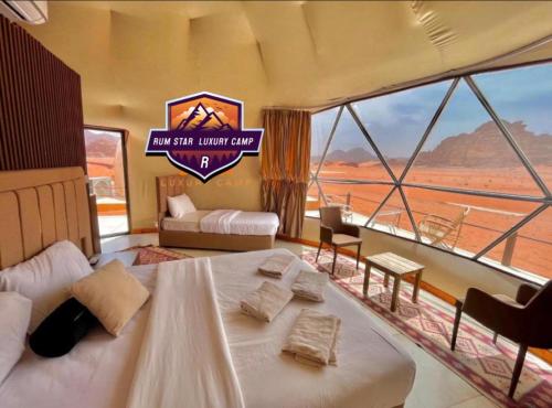 מיטה או מיטות בחדר ב-RUM STAR lUXURY CAMP