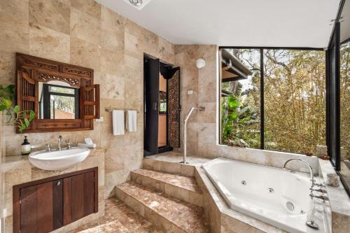 a bathroom with a tub and a sink at Riveresque - Spa Bath - Forest Views in Margaret River Town