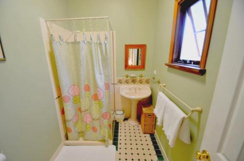 a small bathroom with a sink and a shower at RoseMoore Bed & Breakfast in Perth
