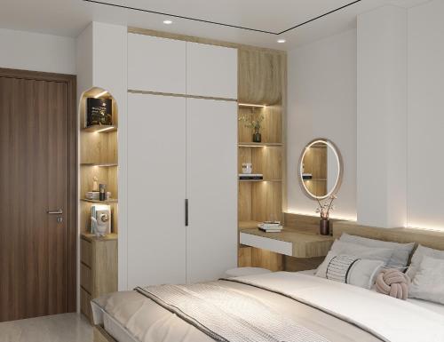a bedroom with a bed and a mirror at Westlake House By Jen in Hanoi