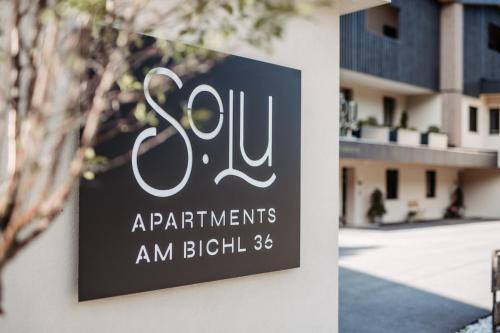 a sign on a building that reads apartments am bililli at SOLU Apartments in Seefeld in Tirol