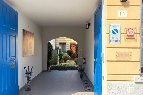 an entrance to a house with blue doors at Il Giardinetto Rooms in Ferrara