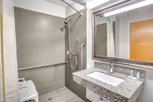 a bathroom with a sink and a shower at Quality Inn Rochester South in Rochester