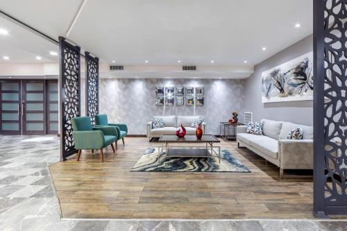 a living room with a couch and two chairs at Quality Inn Piedras Negras in Piedras Negras