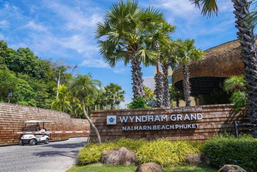 a sign at the entrance to the wynyard grand marriott beach resort at Wyndham Grand Nai Harn Beach Phuket in Nai Harn Beach