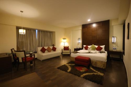 a bedroom with a bed and a living room at Holiday Home Ranchi in Rānchī