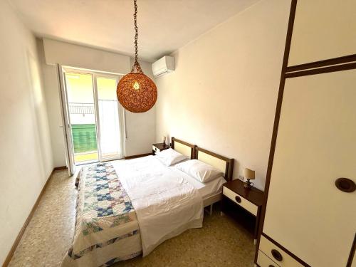a bedroom with a bed and a large window at Casa Liver Pieve in Tremosine Sul Garda