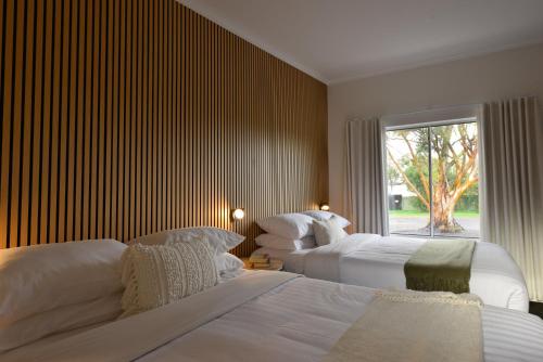 a bedroom with two beds and a window at Sea Lake Motel-24 Hour Check-In Private Ensuite Rooms in Sea Lake
