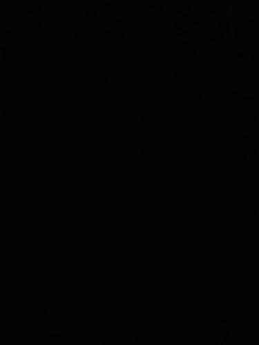 a dark room with a black background at Rum lmea in Disah