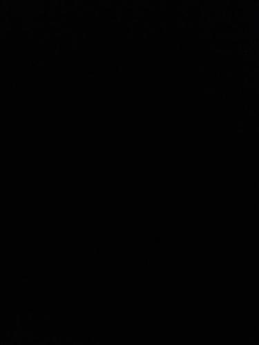 a dark room with a clock on the wall at Rum lmea in Disah