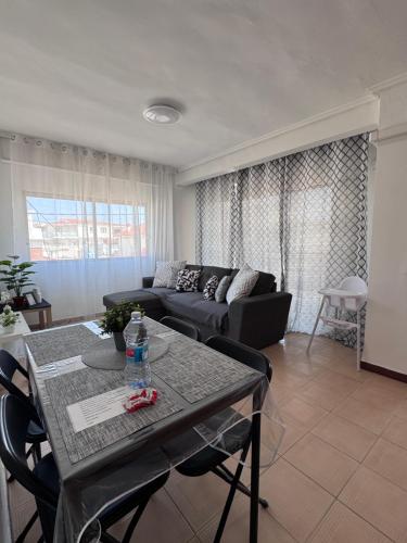 a living room with a couch and a table at La casa de la Brisa in Piles