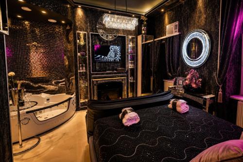 a bathroom with a bed and a tub and a sink at Urban Budget Hotel- Unique Boutique Hotel on Best Location in Vienna