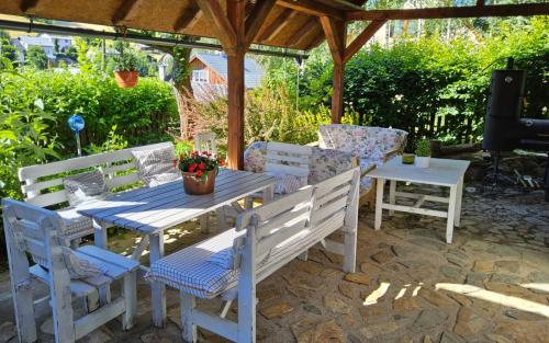 a table and two chairs and a table and a table and chairs at Chalupa pod Lysou - Apartma 4rooms in Rokytnice nad Jizerou