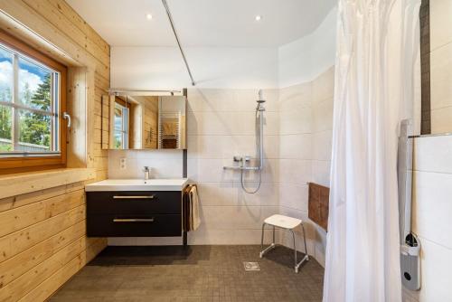 a bathroom with a sink and a shower at Ferienhaus Traum Teufel in Hettingen