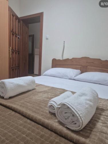 two towels on two beds in a bedroom at Vila Lenka in Rtanj