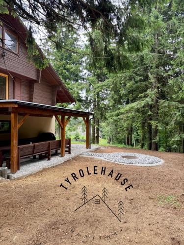 a sign that says wilderness in front of a house at Chata - TYROLEHAUSE in Martin