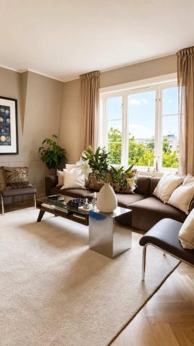a living room with a couch and a table at SV3G 3BR Villa with Patio in Oslo
