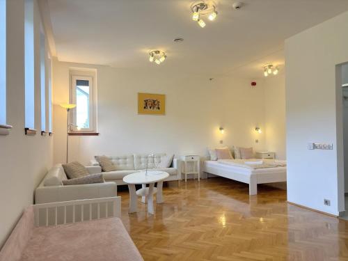 a living room with a couch and a table at Szilva Ház in Szilvásvárad